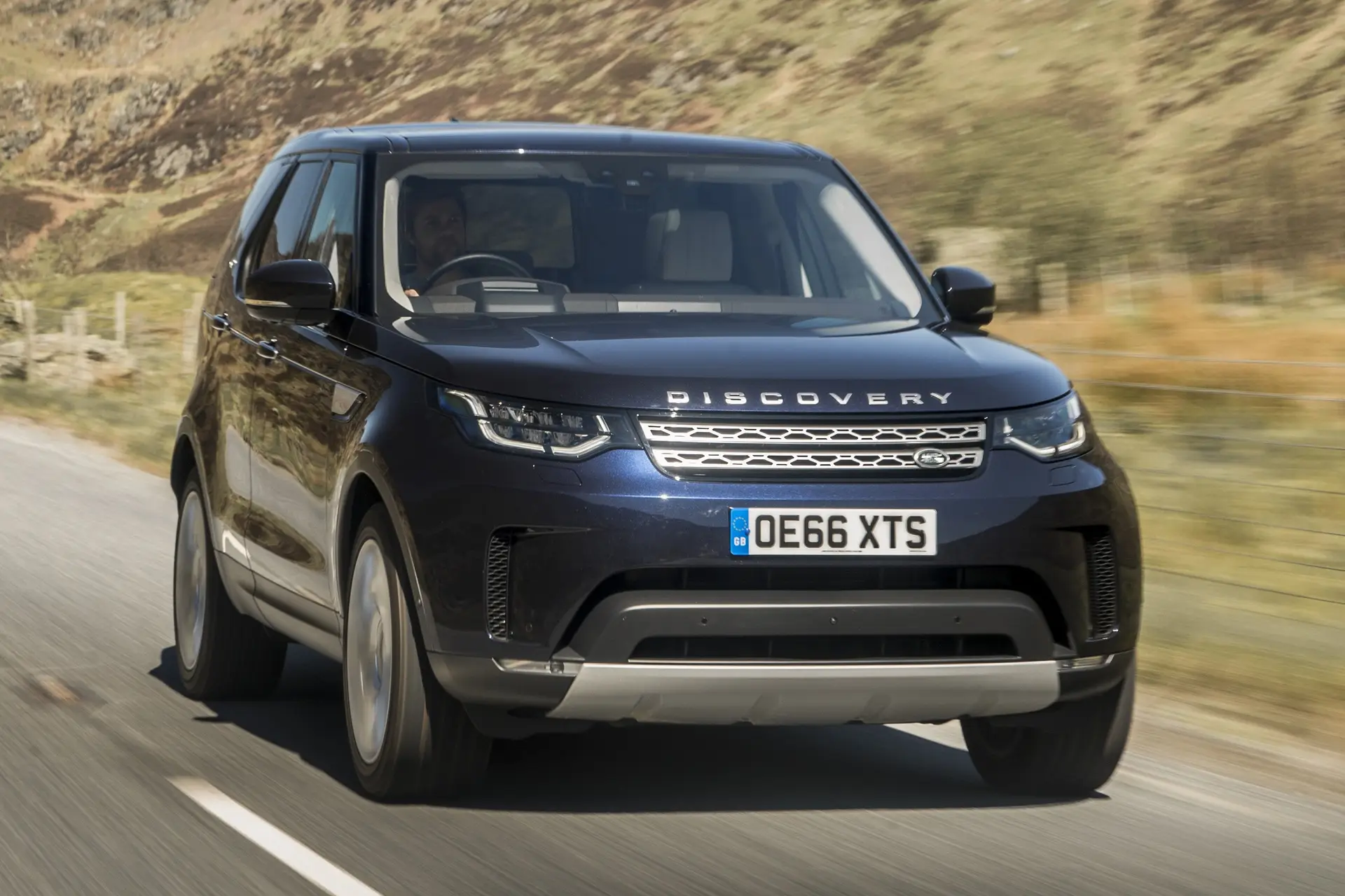 Land Rover Discovery 2023 Review: exterior front three quarter photo of the Land rover Discovery on the road
