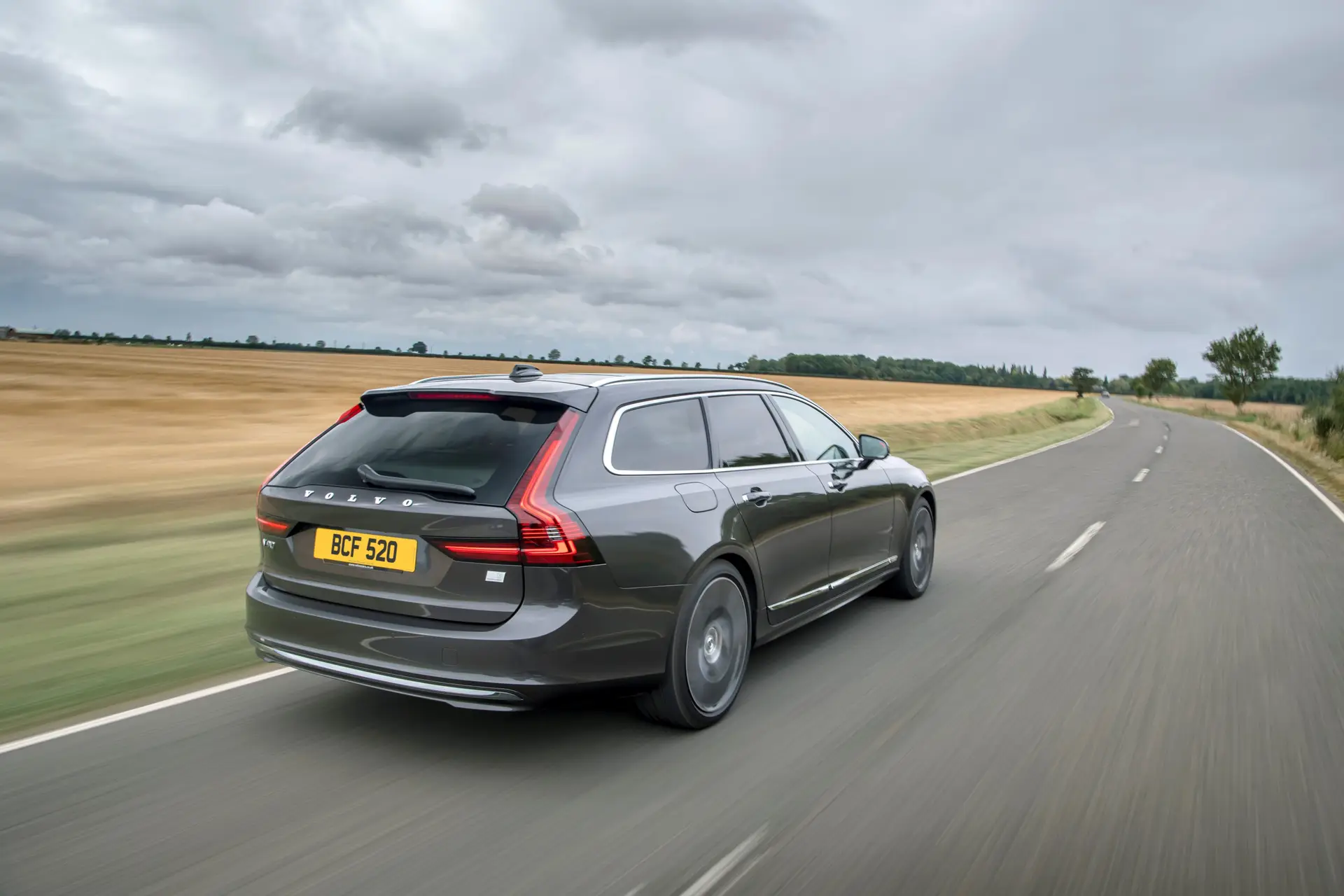 Volvo V90 Review 2023: exterior rear three quarter photo of the Volvo V90 on the road