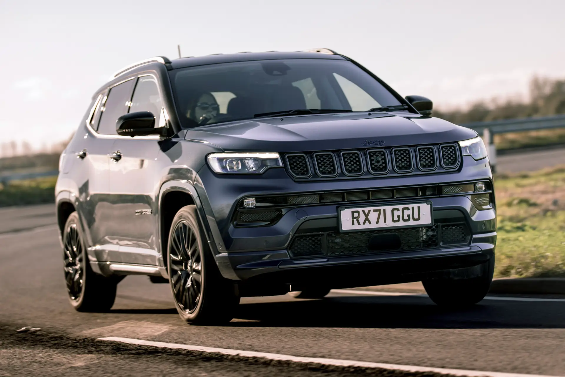 Jeep Compass Review 2024: exterior front three quarter photo of the Jeep Compass on the road