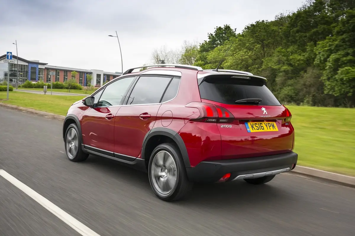 Peugeot 2008 (2013-2019) Review: exterior rear three quarter photo of the Peugeot 2008 on the road