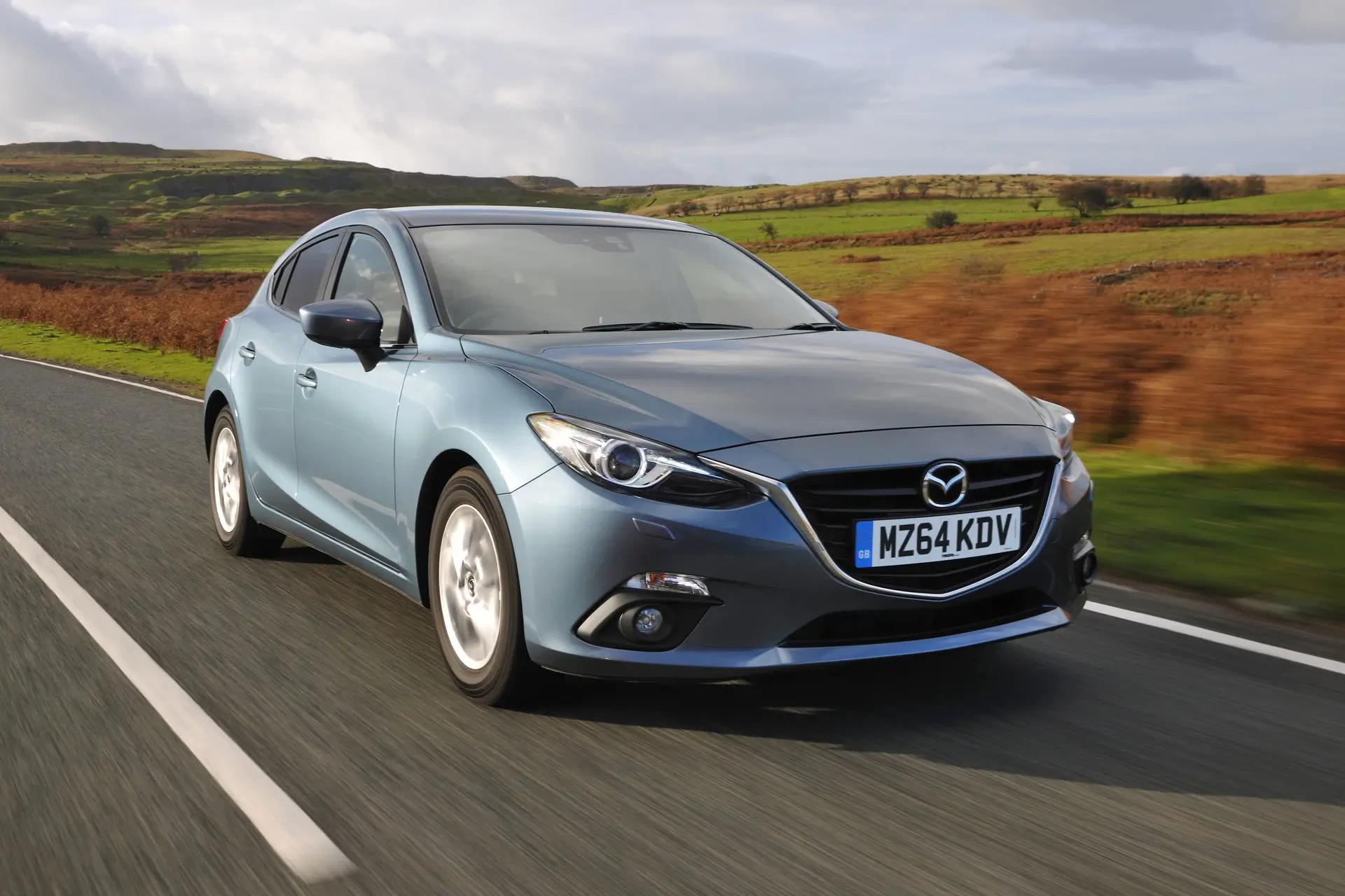 Mazda 3 (2014-2019) Review: exterior front three quarter photo of the Mazda 3 on the road