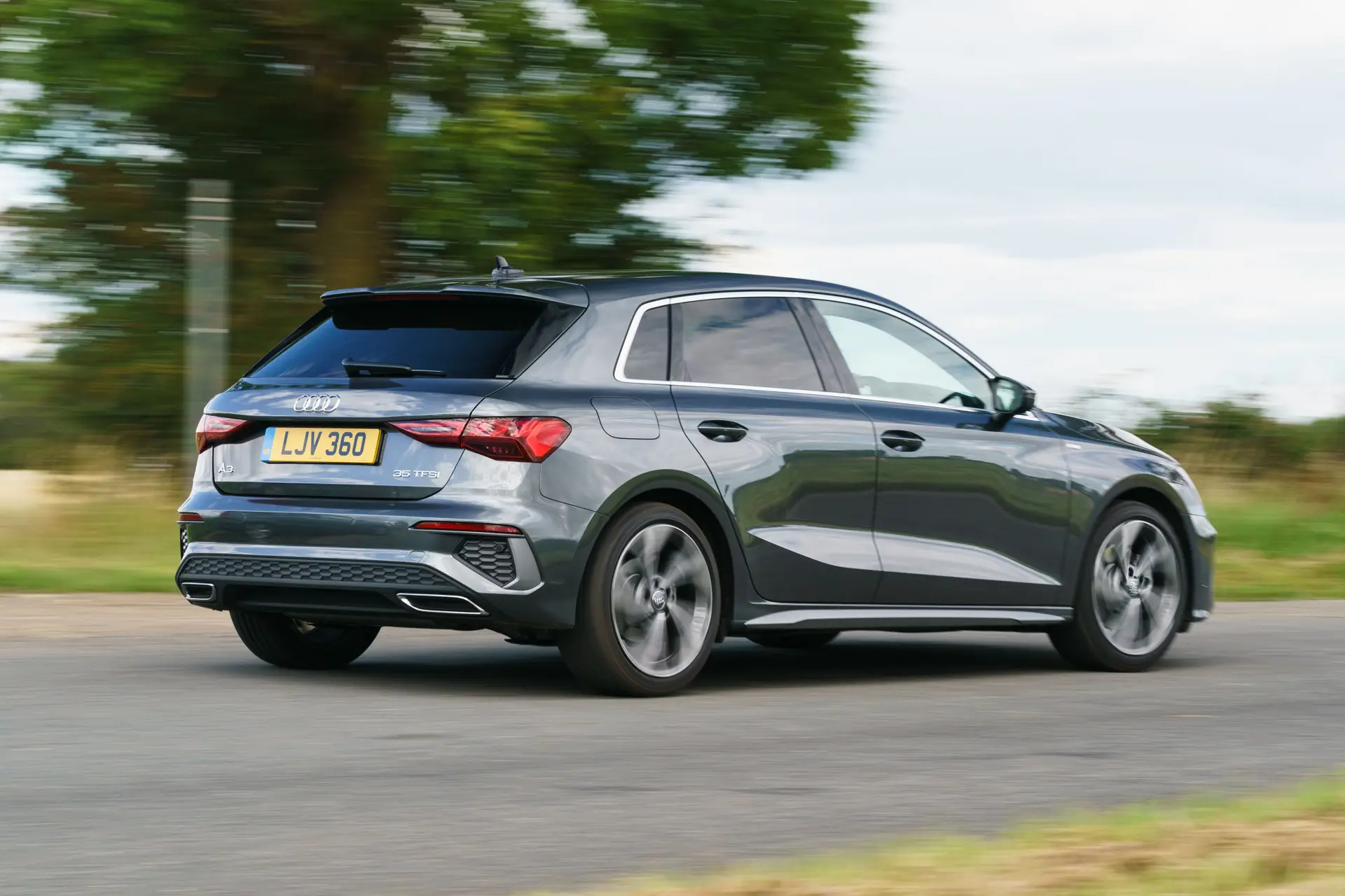 Audi A3 Review 2023: exterior rear three quarter photo of the Audi A3 Sportback on the road