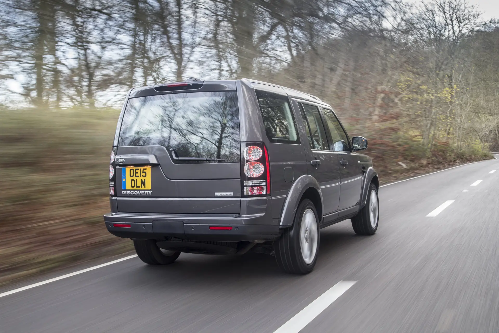 Land Rover Discovery 4 (2009-2017) Review: Exterior rear three quarter photo of the Land Rover Discovery 4 on the road