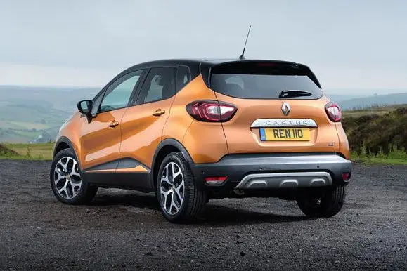 Renault Captur (2013-2019) Review: exterior rear three quarter photo of the Renault Captur on the road