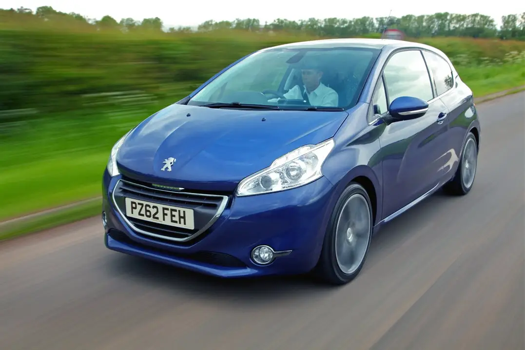 Peugeot 208 (2012-2019) Review: exterior front three quarter photo of the Peugeot 208 on the road