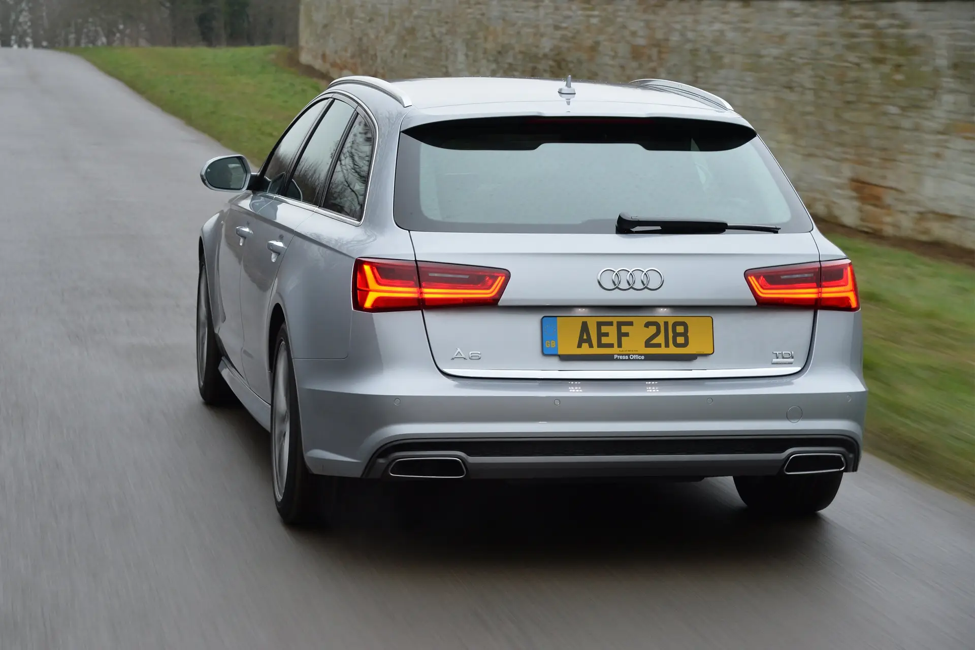 Audi A6 Avant (2011-2018) Review: exterior rear three quarter photo of the Audi A6 Avant on the road