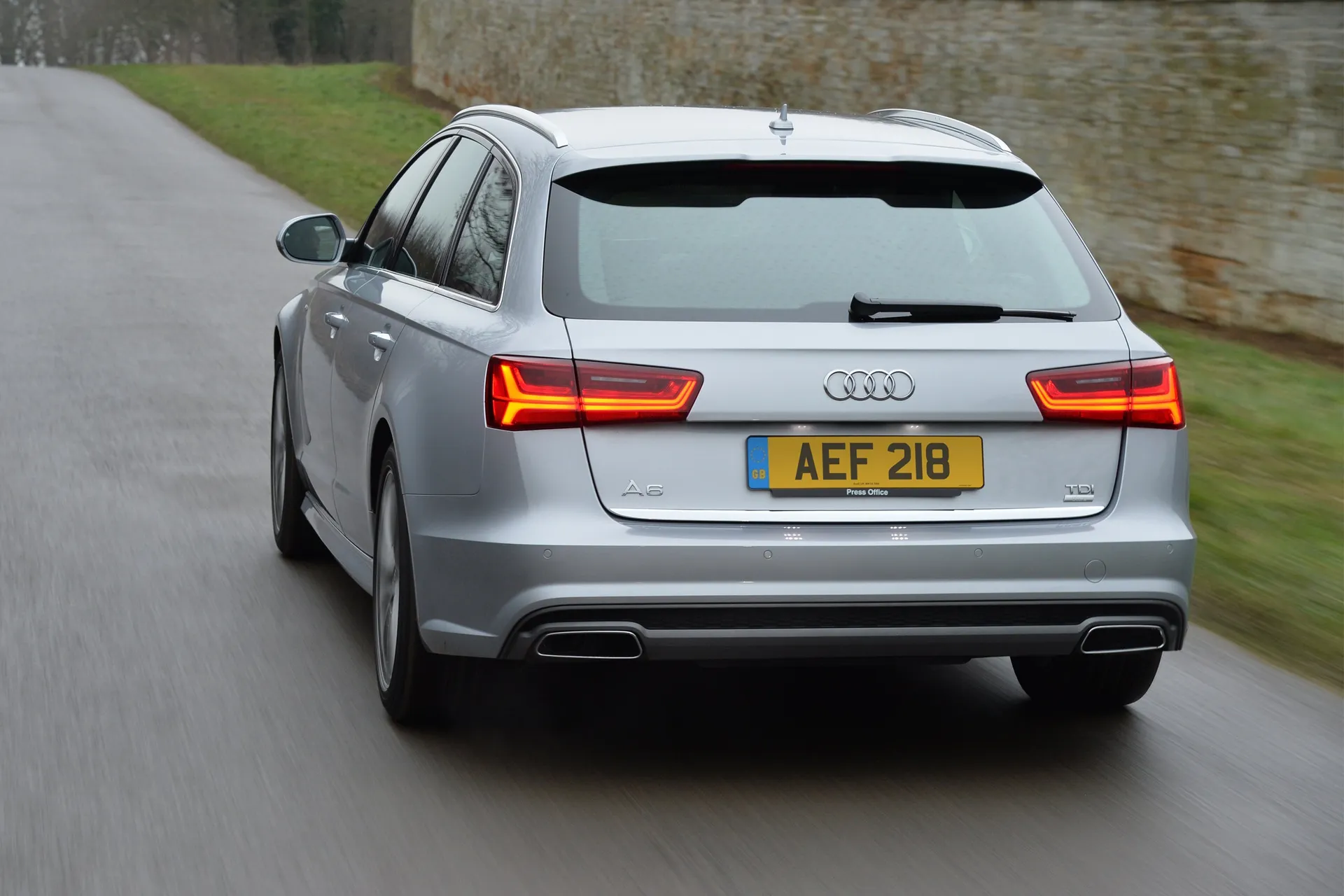 Audi A6 Avant (2011-2018) Review: exterior rear three quarter photo of the Audi A6 Avant on the road