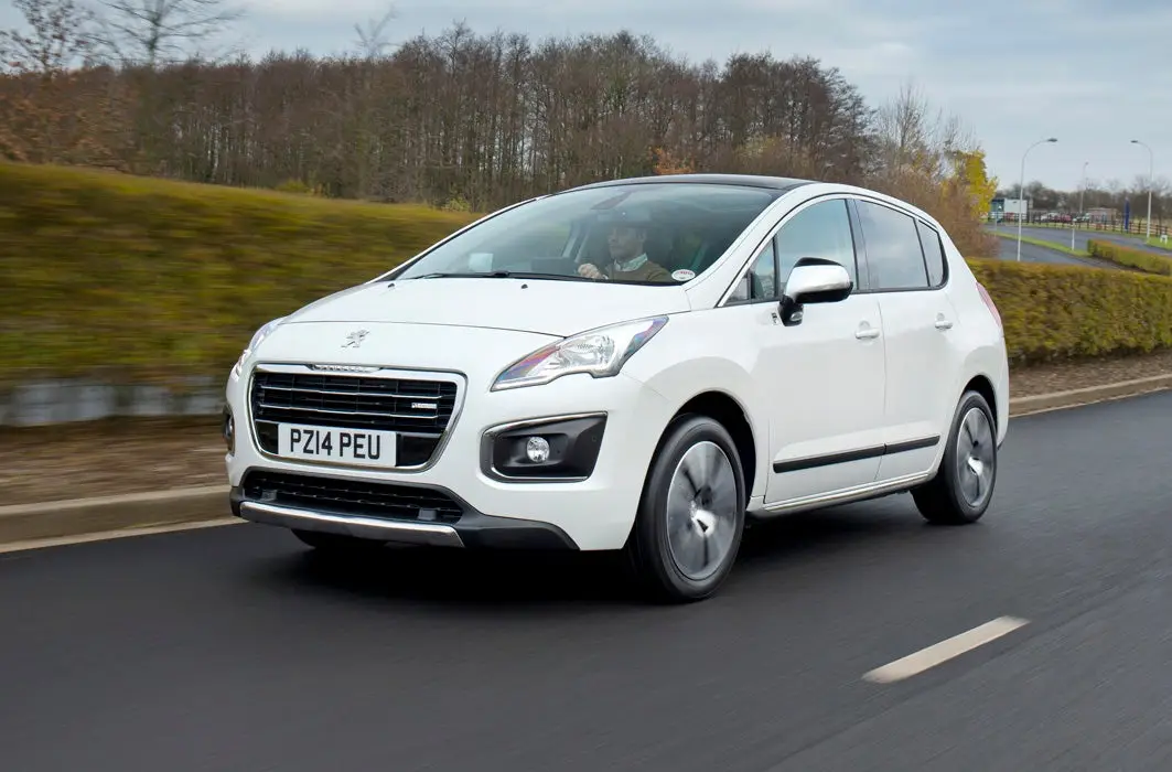 Peugeot 3008 (2009-2017) Review: Exterior front three quarter photo of the Peugeot 3008 on the road
