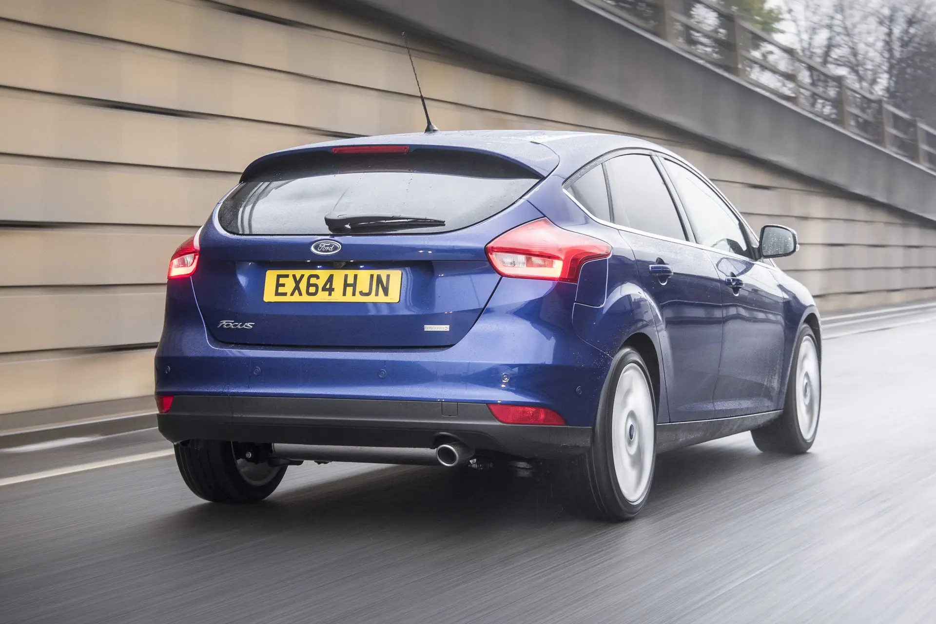 Ford Focus (2014-2018) Review: exterior rear three quarter photo of the Ford Focus on the road