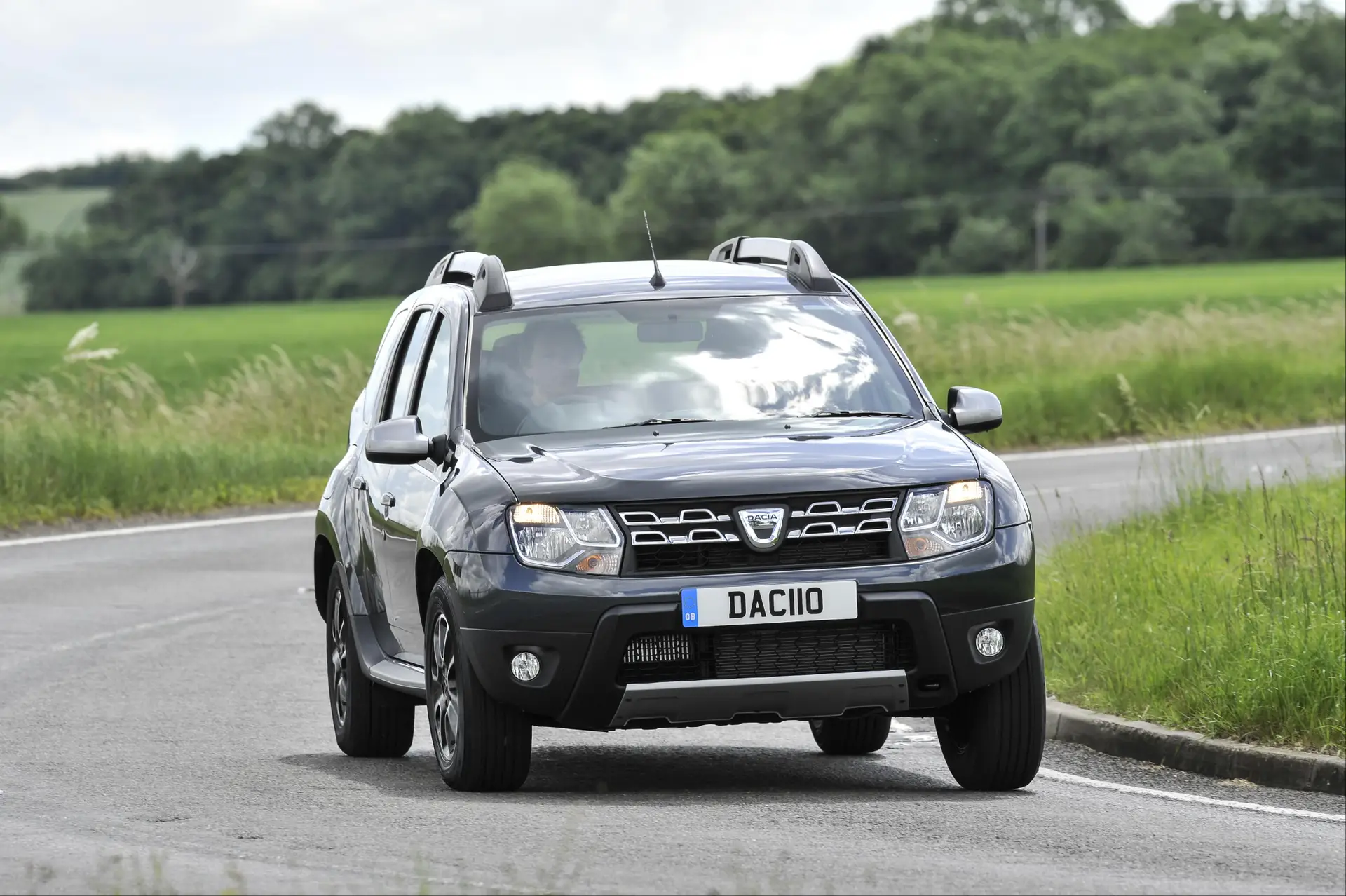 Used Dacia Duster (2012-2018) Review: exterior front three quarter photo of the Dacia Duster on the road 