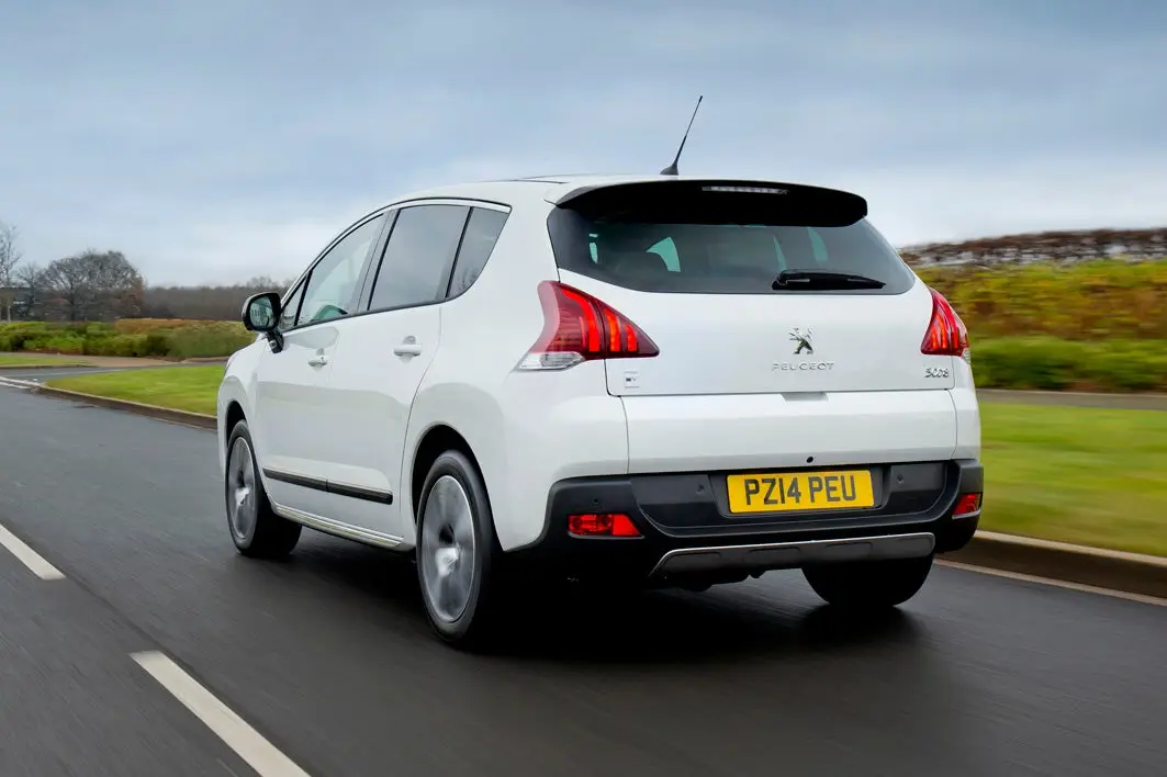 Peugeot 3008 (2009-2017) Review: Exterior rear three quarter photo of the Peugeot 3008 on the road