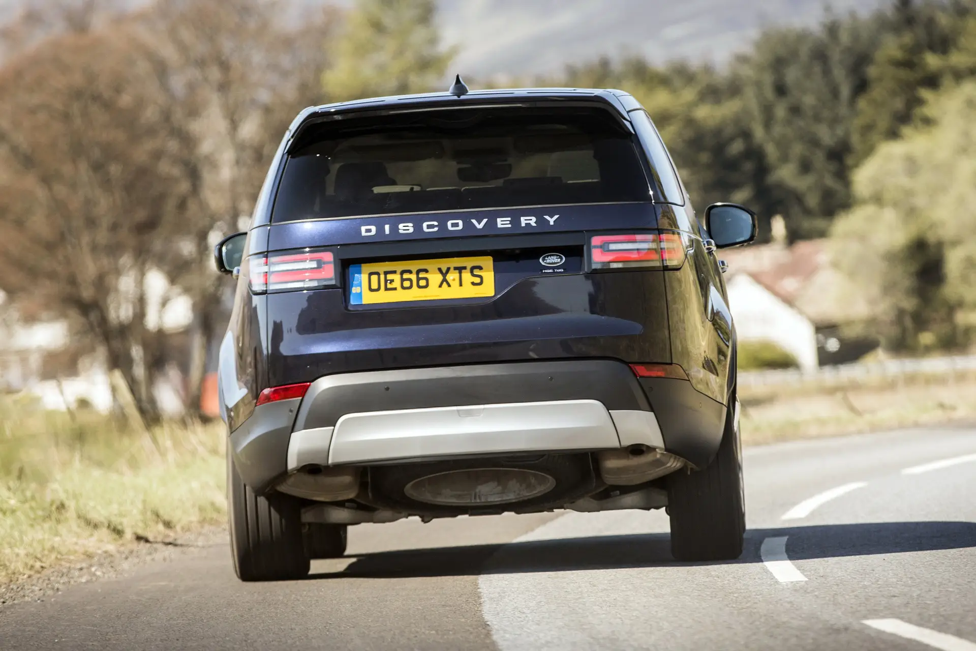 Land Rover Discovery 2023 Review: exterior rear photo of the Land Rover Discovery on the road