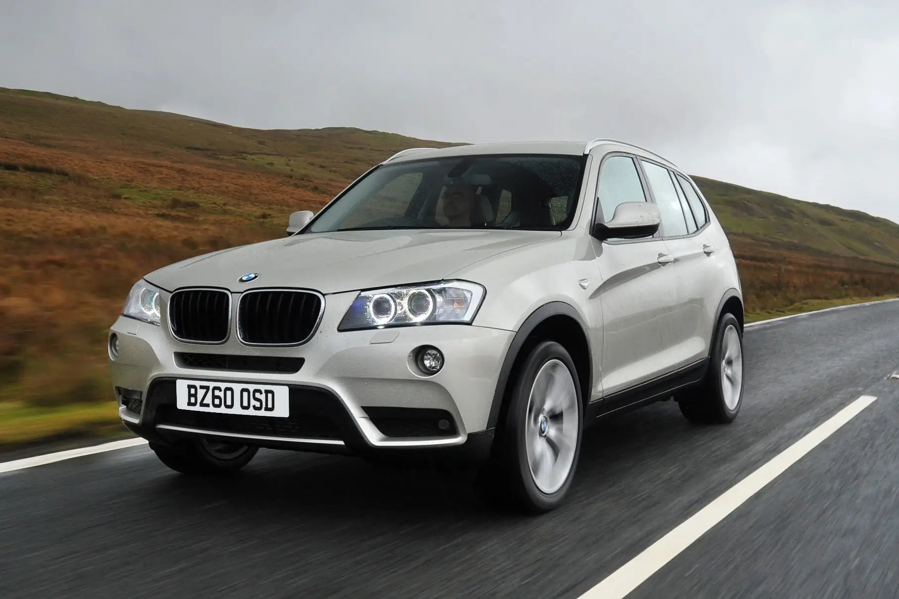 BMW X3 (2010-2018) Review: Exterior front three quarter photo of the BMW X3 on the road