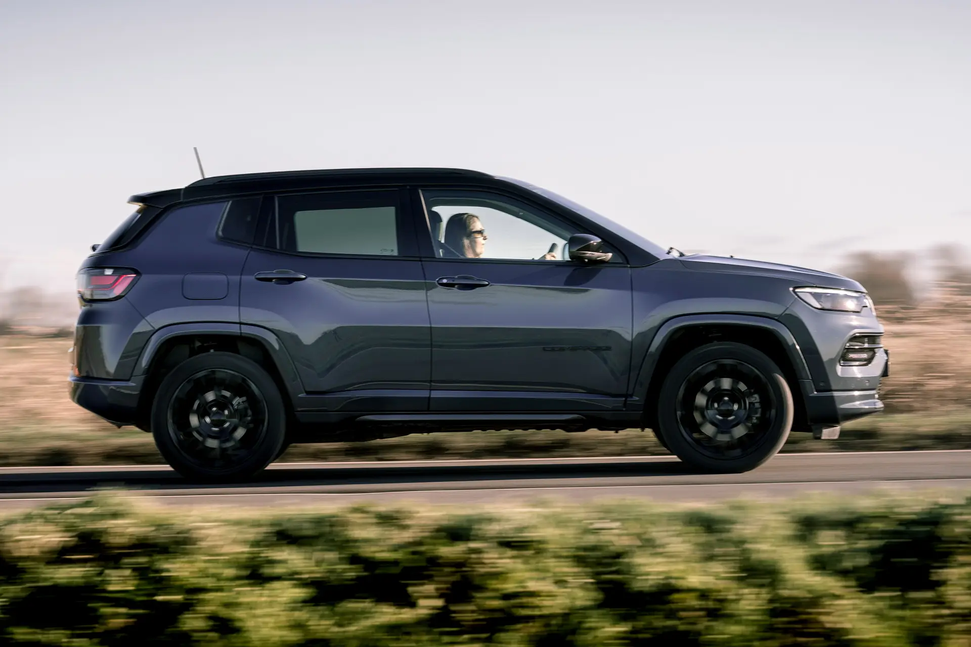 Jeep Compass Review 2024: exterior side photo of the Jeep Compass on the road