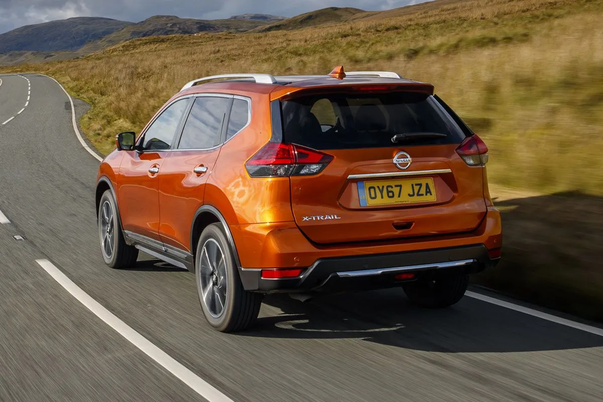 Nissan X-Trail (2013-2022) Review: exterior rear three quarter photo of the Nissan X-Trail on the road