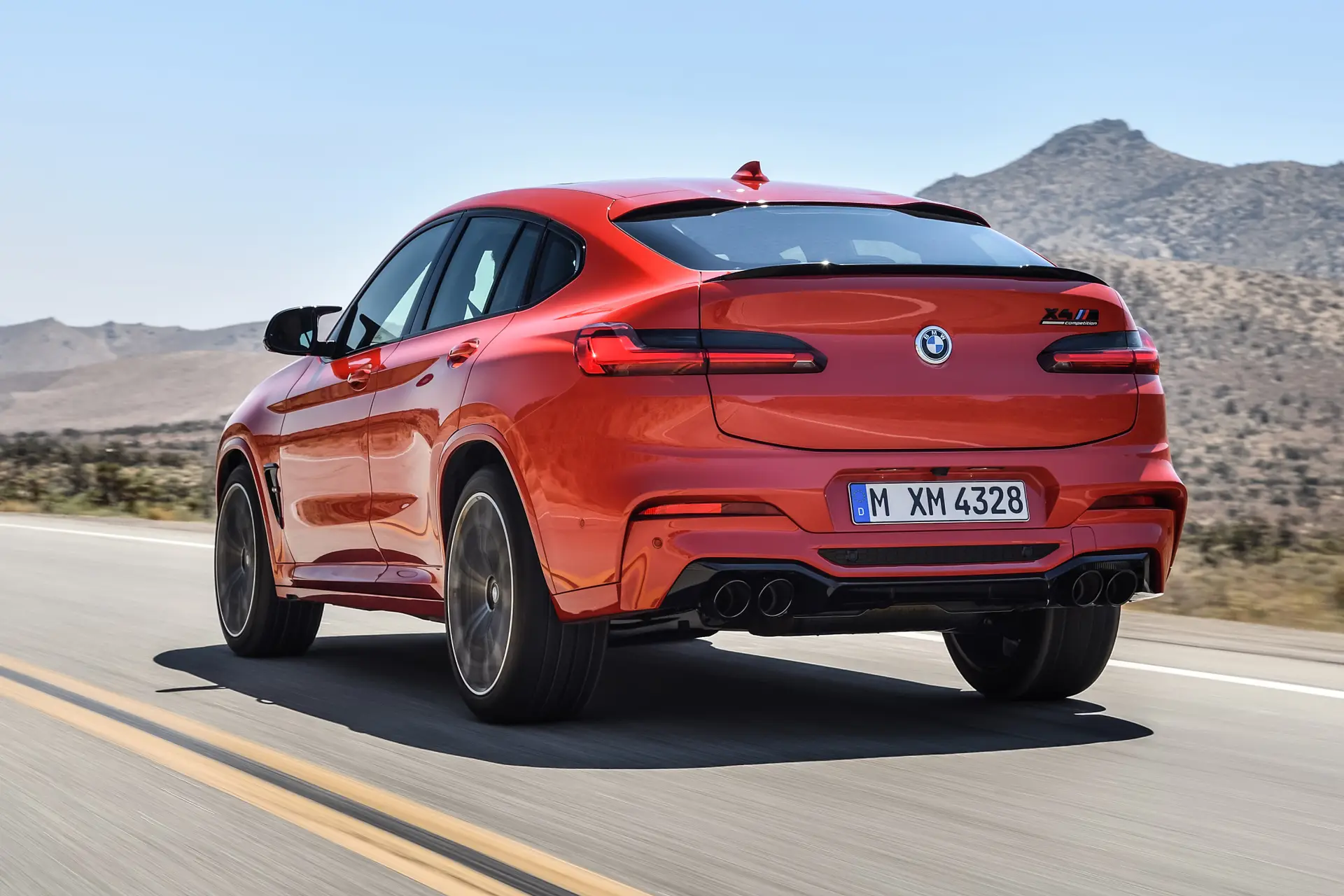 BMW X4 M Competition Review 2023 dynamic rear-three quarter