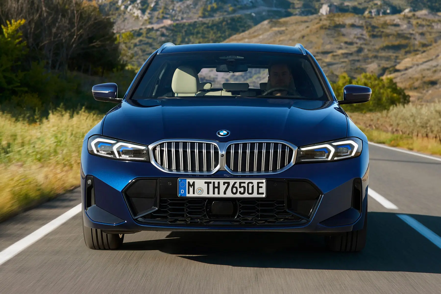 BMW 3 Series Touring Review 2023: exterior front photo of the BMW 3 Series Touring on the road