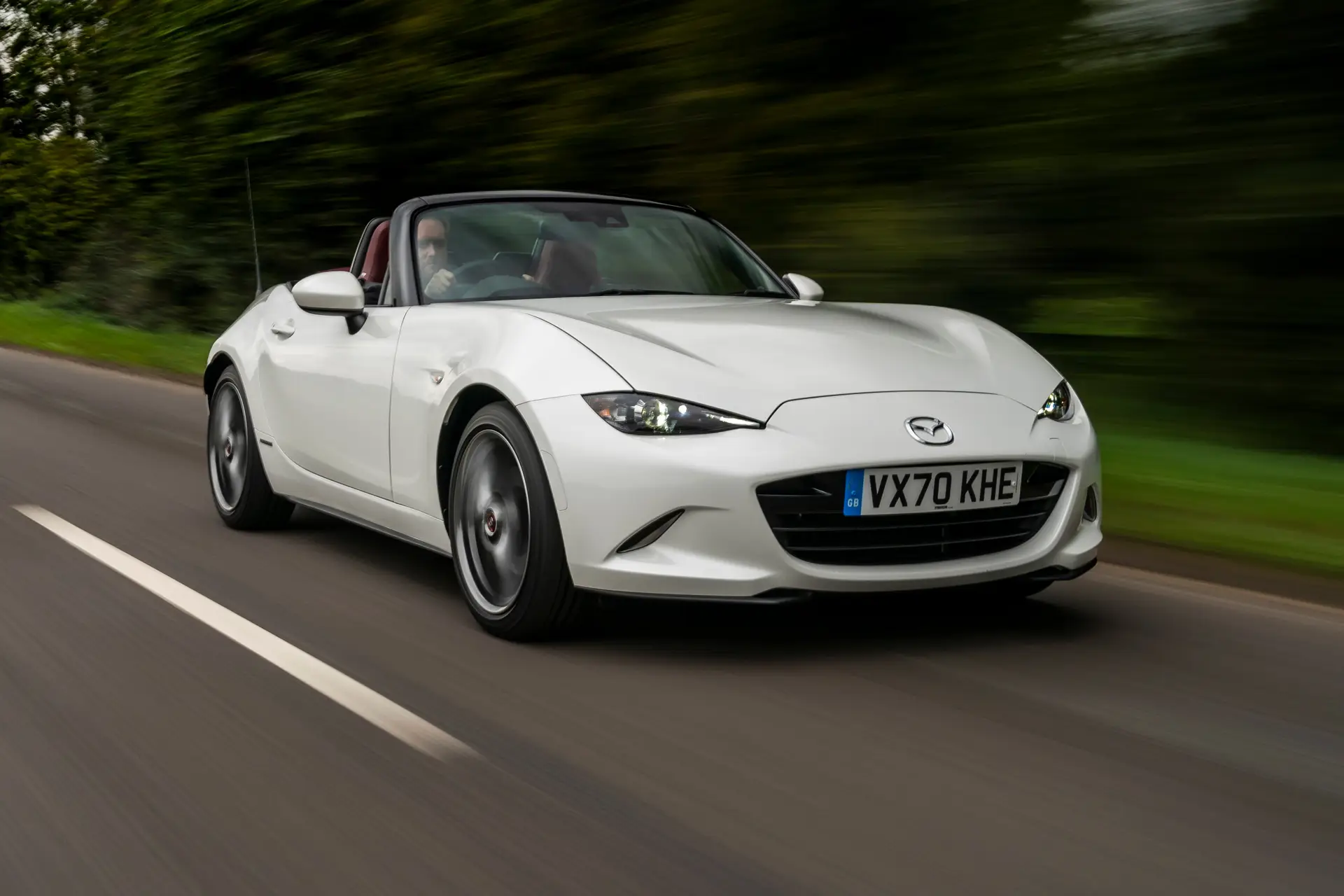 Mazda MX-5 Review 2023: exterior front three quarter photo of the Mazda MX-5 on the road