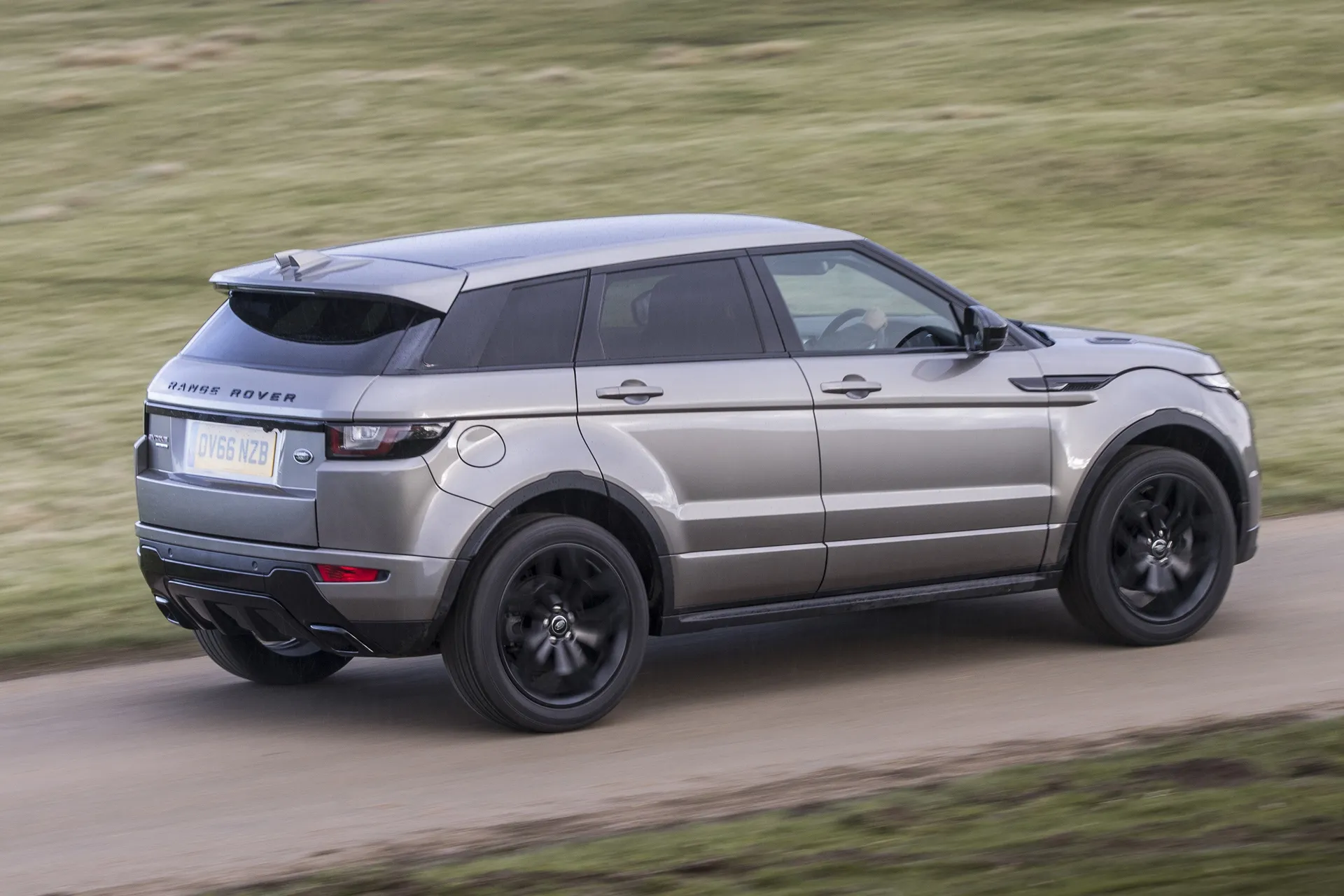 Range Rover Evoque (2011-2019) Review: exterior rear three quarter photo of the Range Rover Evoque on the road