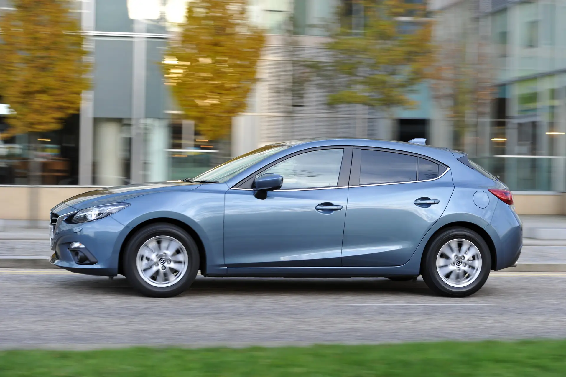 Mazda 3 (2014-2019) Review: exterior side photo of the Mazda 3 on the road