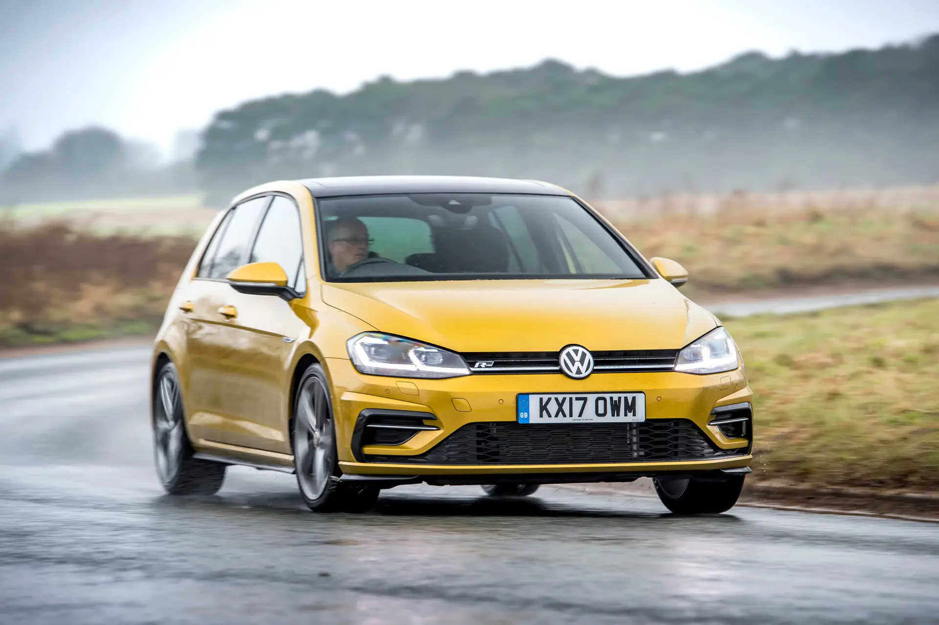 Volkswagen Golf (2013-202) Review: exterior front three quarter photo of the Volkswagen Golf on the road
