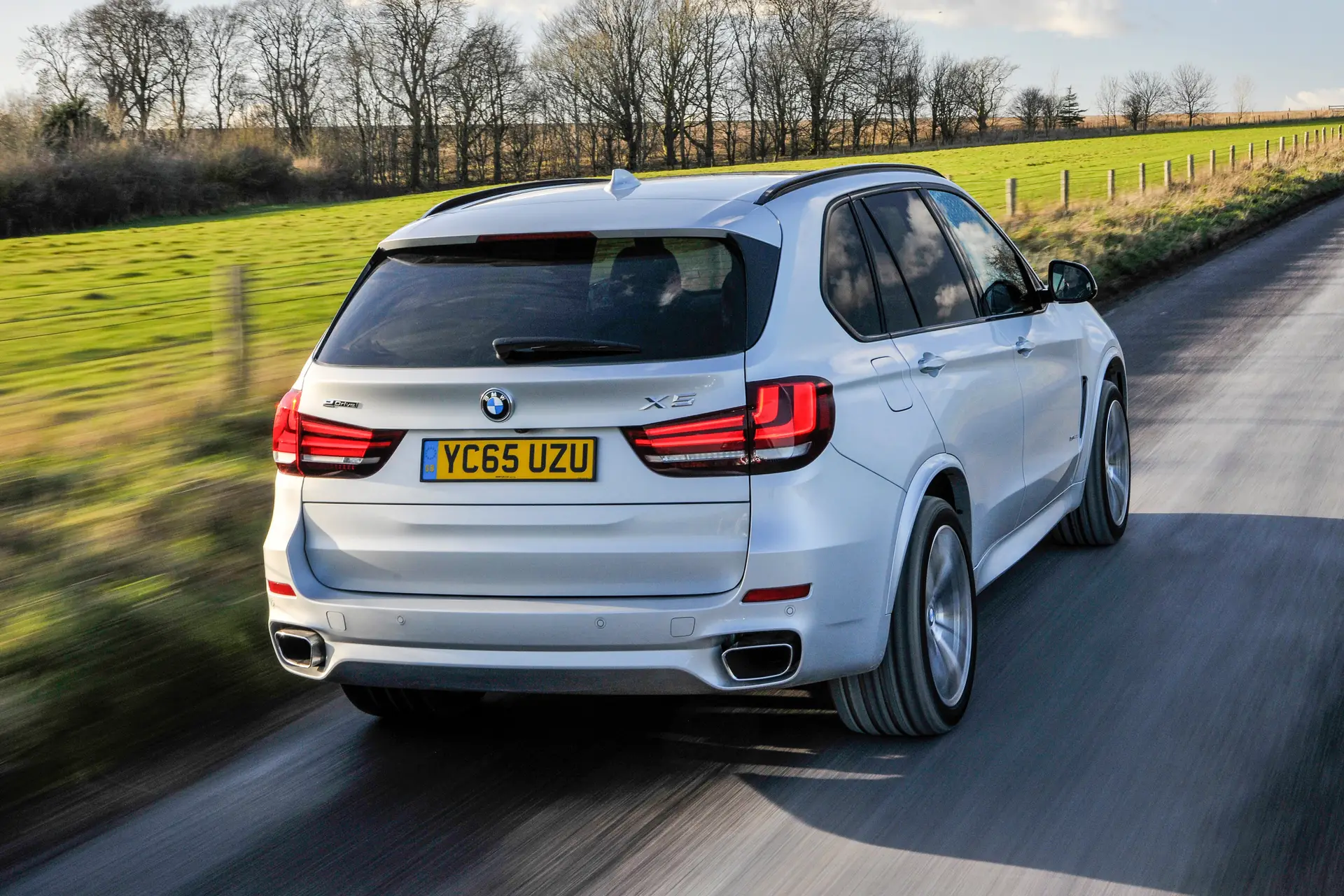 BMW X5 (2014-2018) Review:  Exterior rear three quarter photo of the BMW X5 on the road