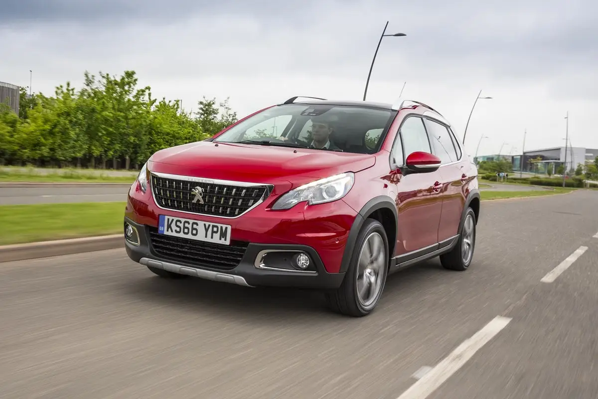 Peugeot 2008 (2013-2019) Review: exterior front three quarter photo of the Peugeot 2008 on the road