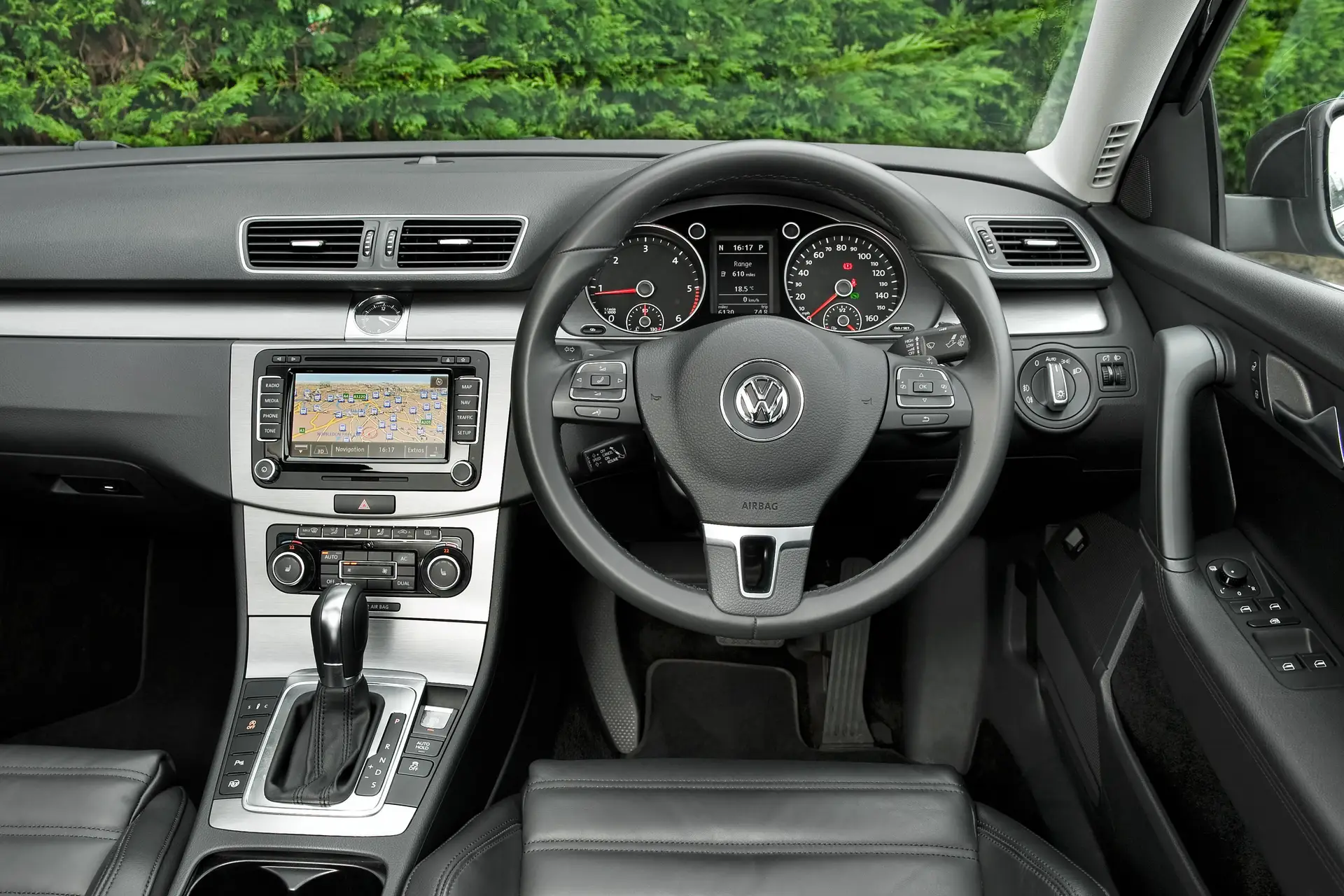 Volkswagen Passat (2011-2015) Review: interior close up photo of the Volkswagen Passat dashboard