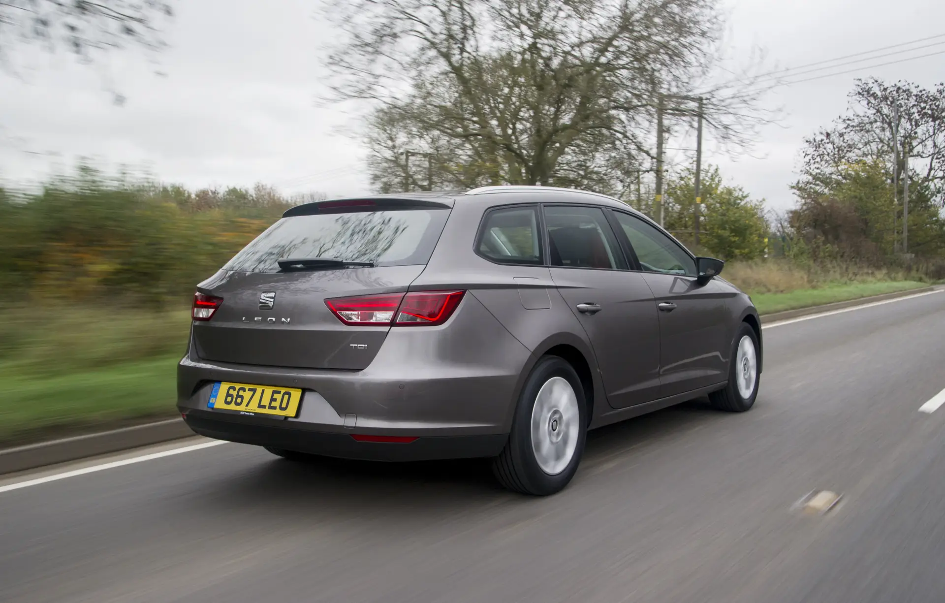 SEAT Leon ST (2014-2020) Review: exterior rear three quarter photo of the SEAT Leon ST on the road