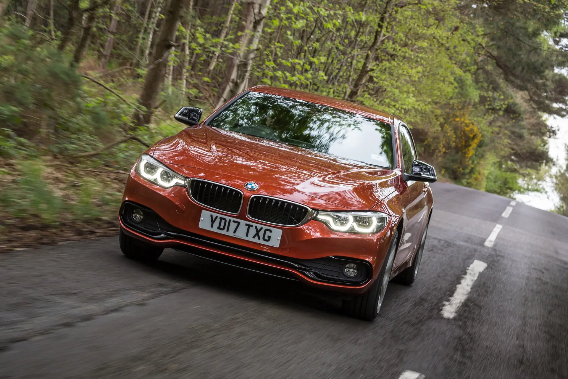 BMW 4 Series Coupe (2013-2020) Review: Exterior front photo of the BMW 4 Series Coupe on the road 