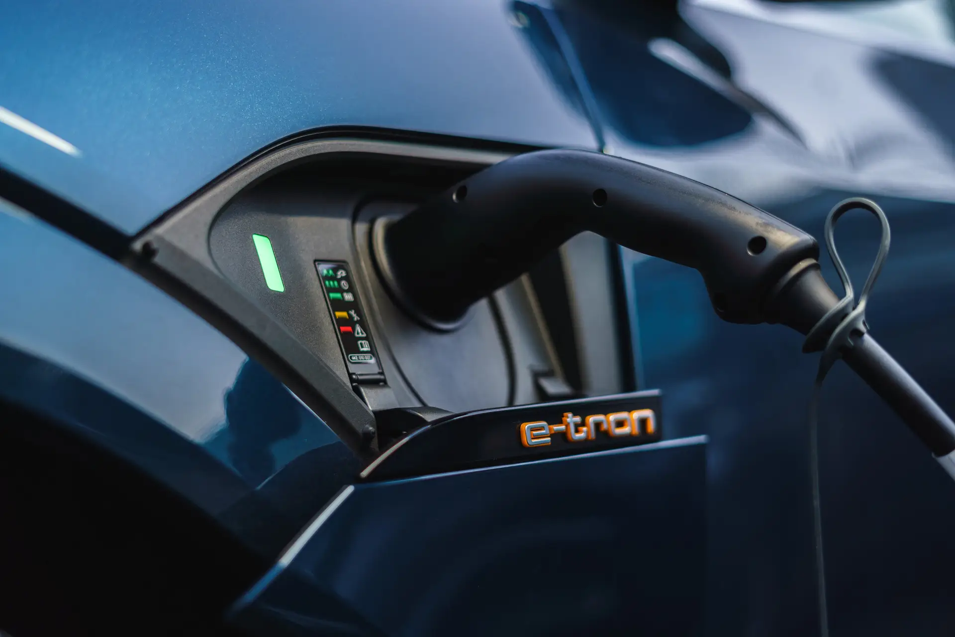 Audi e-tron Review 2023: exterior close up photo of the Audi e tron charging 