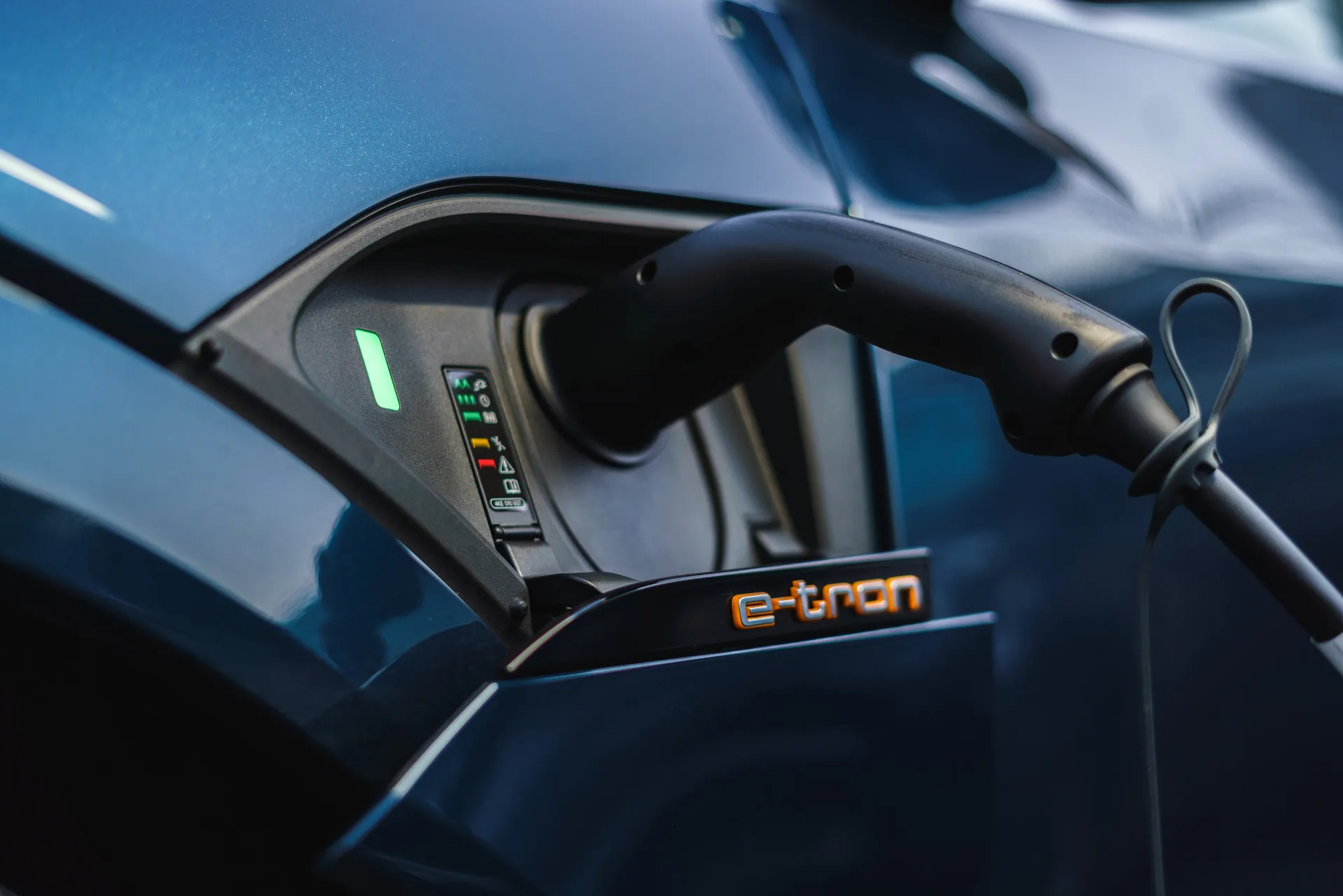 Audi e-tron (2019-2022) Review: exterior close up photo of the Audi e tron charging