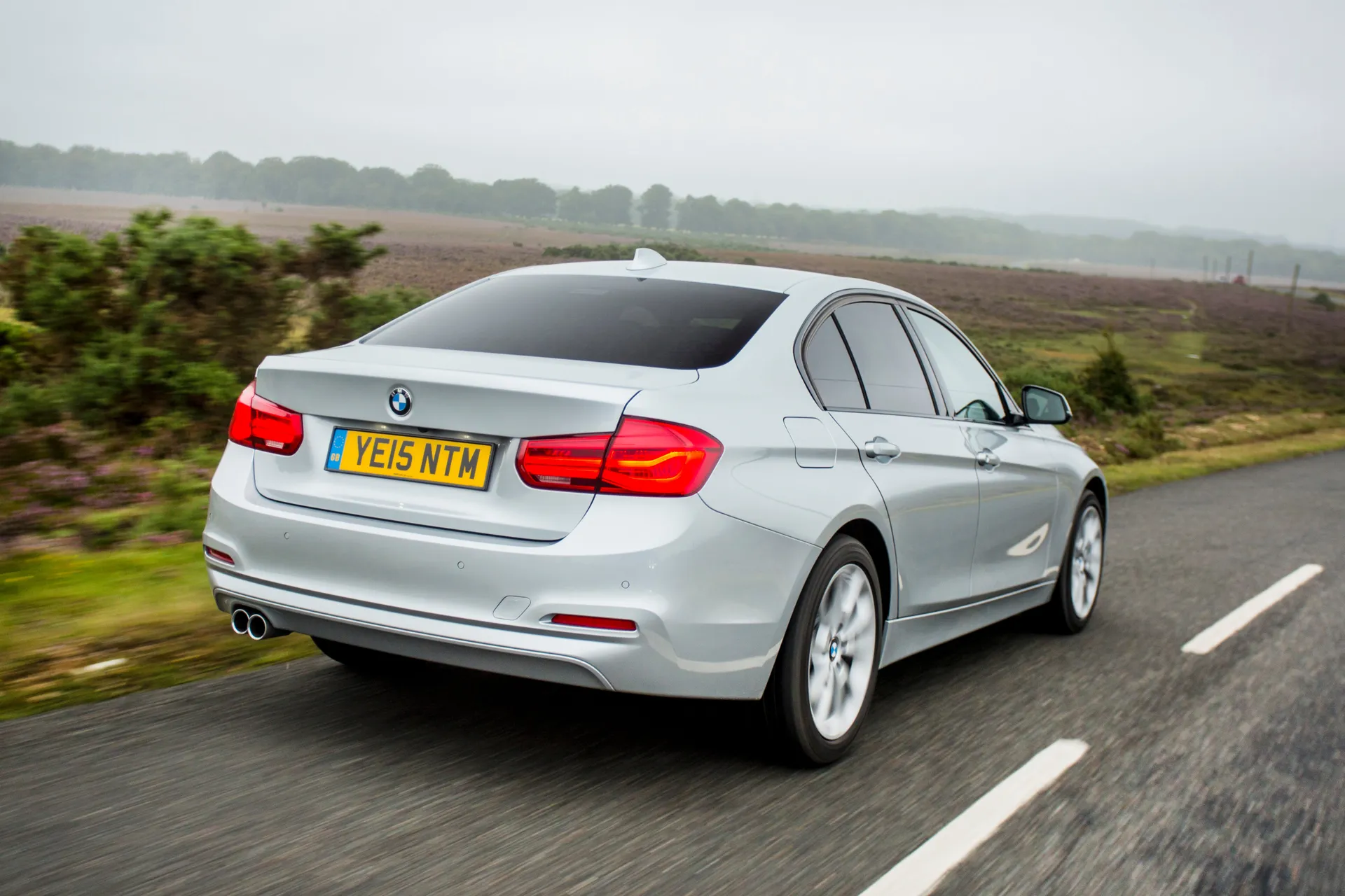 BMW 3 Series (2012-2018) Review: Exterior rear three quarter photo of the BMW 3 Series on the road