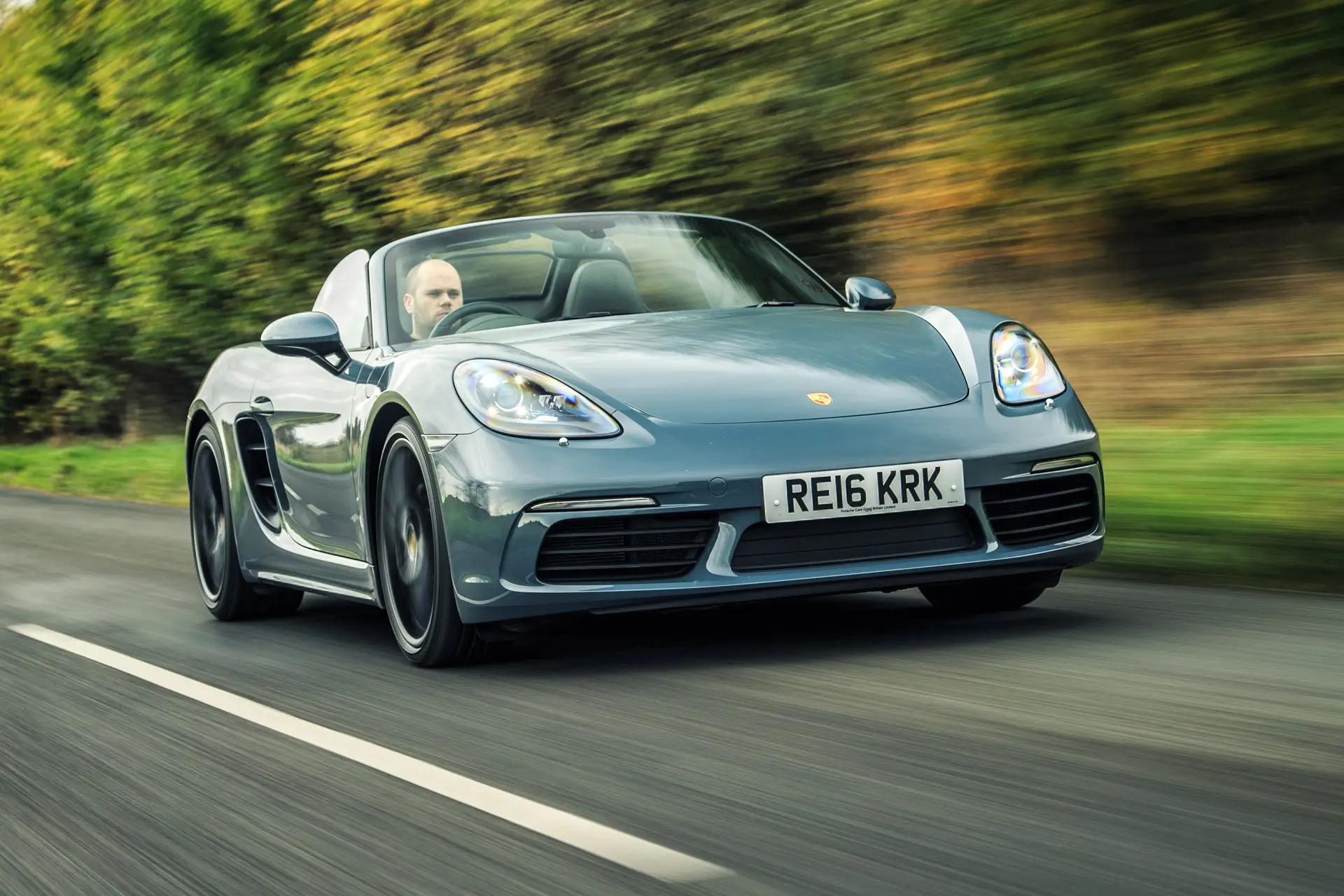 Porsche 718 Boxster Review 2023: exterior front three quarter photo of the Porsche Boxster 718 on the road