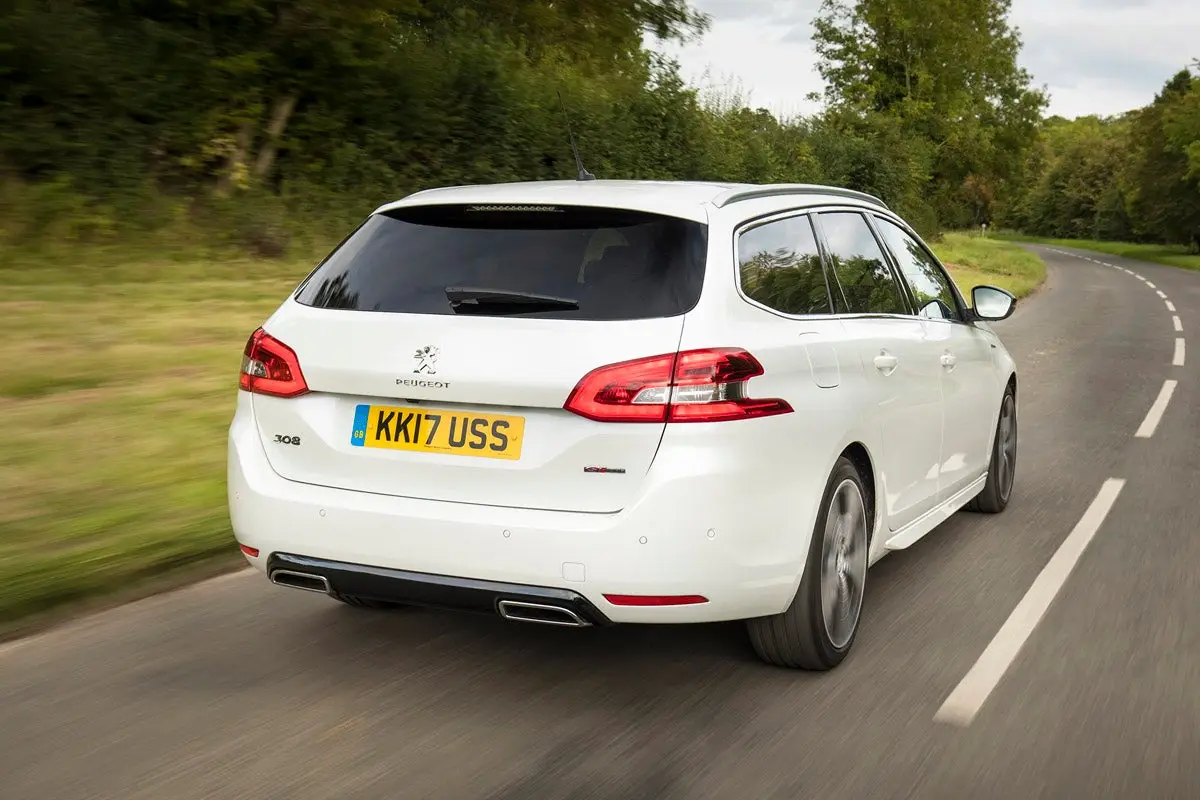 Peugeot 308 SW (2014-2021) Review: exterior rear three quarter photo of the Peugeot 308 SW on the road