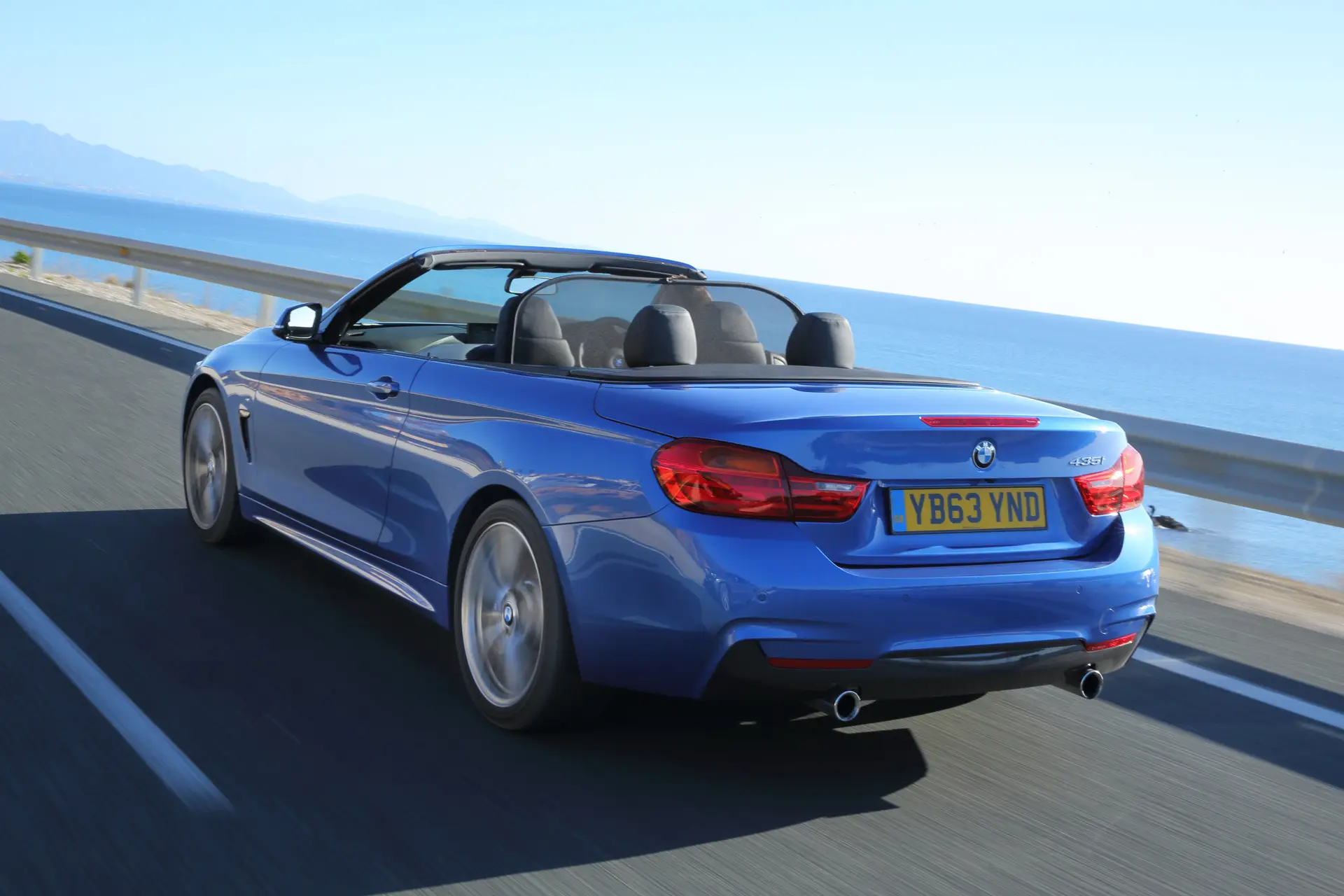 BMW 4 Series Convertible (2014-2020) Review: exterior rear three quarter photo of the BMW 4 Series Convertible on the road