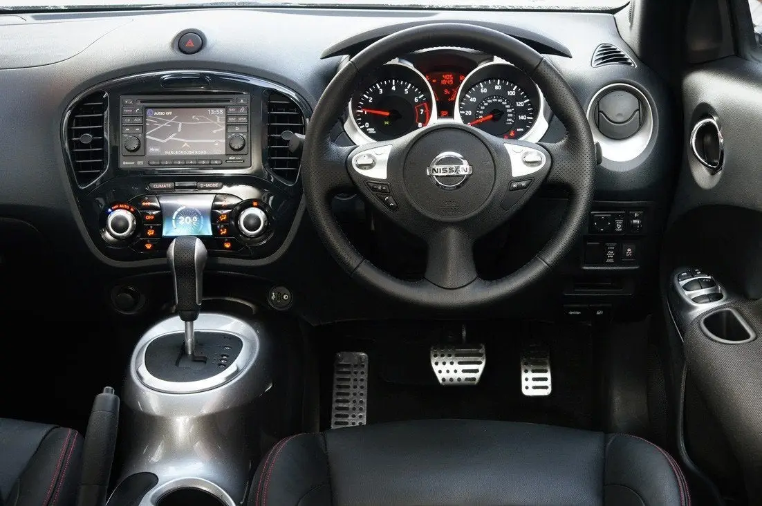 Nissan Juke (2010-2019) Review: interior close up photo of the Nissan Juke dashboard