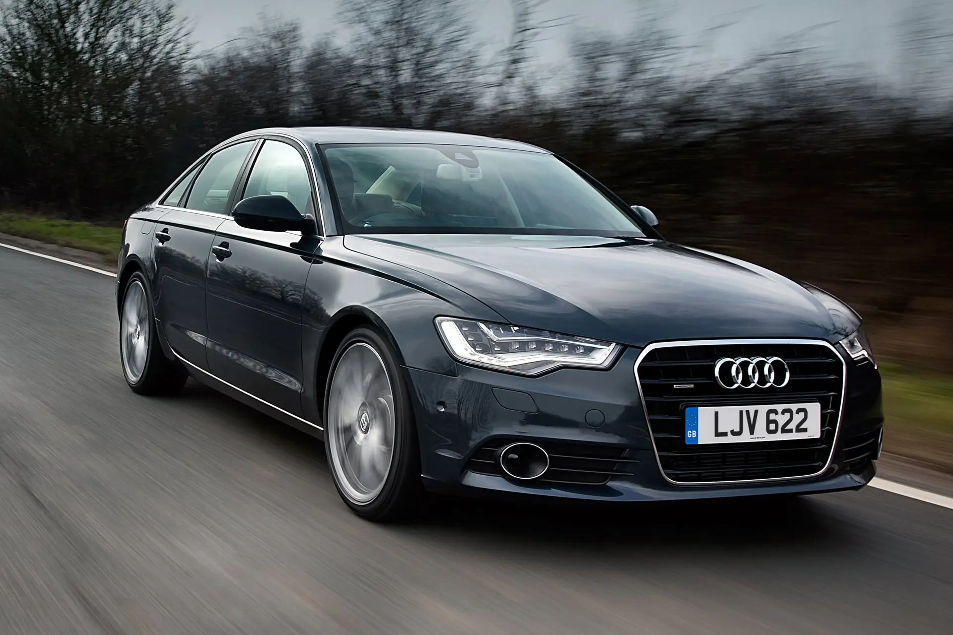 Used Audi A6 (2011-2018) Review: Exterior front three quarter photo of the Audi A6 on the road 