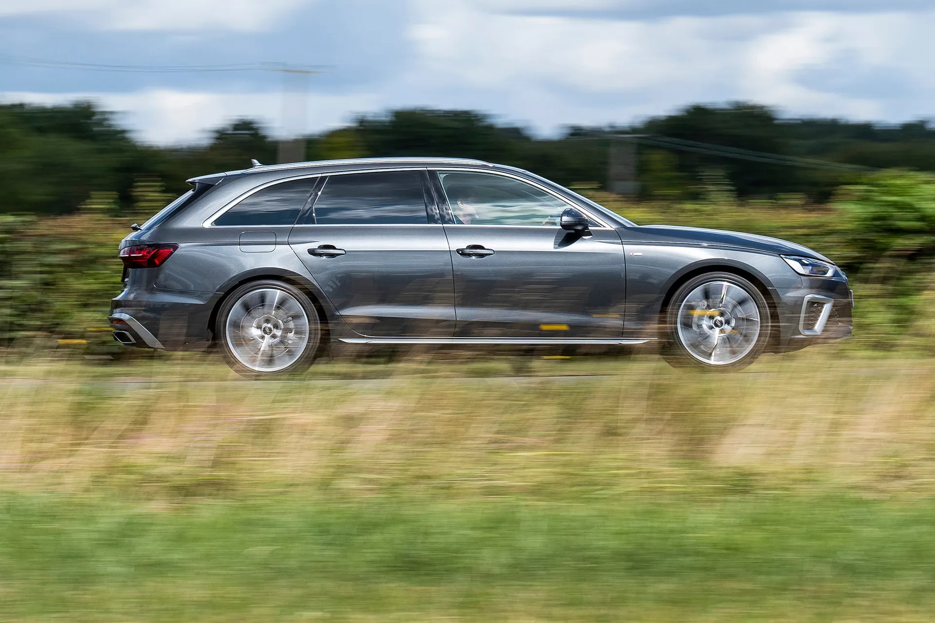 Audi A4 Avant (2015-2025) Review: exterior side photo of the Audi A4 Avant on the road