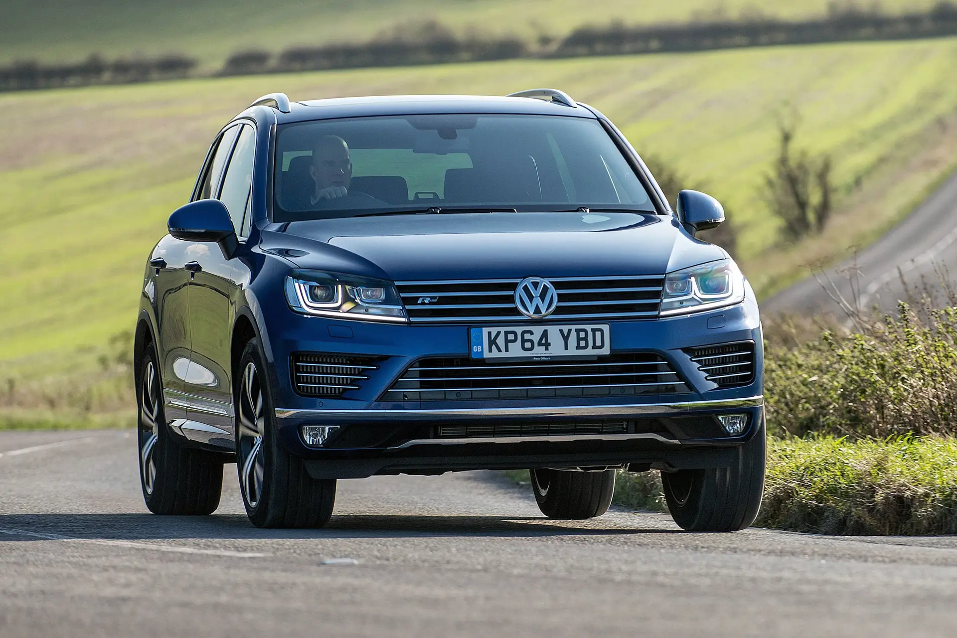  Volkswagen Touareg (2010-2018) Review: exterior front three quarter photo of the Volkswagen Touareg on the road