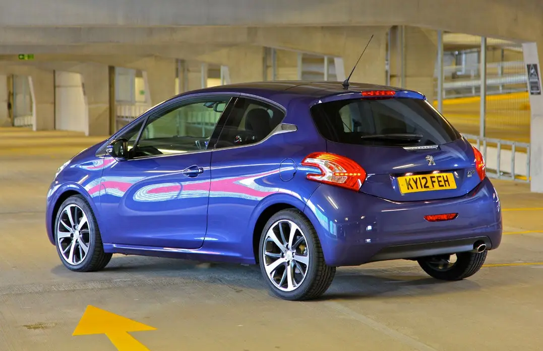 Peugeot 208 (2012-2019) Review: exterior rear three quarter photo of the Peugeot 208 on the road