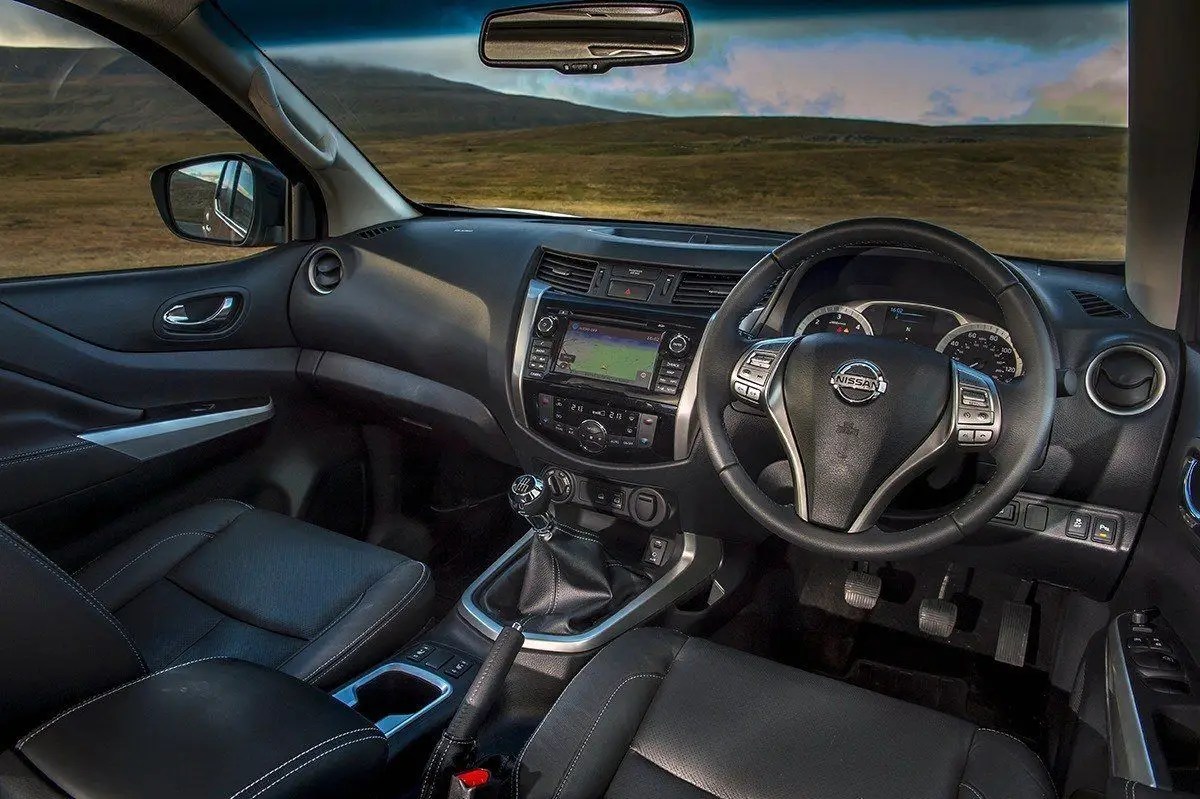 Nissan Navara (2014-2023) Review: interior close up photo of the Nissan Navara dashboard