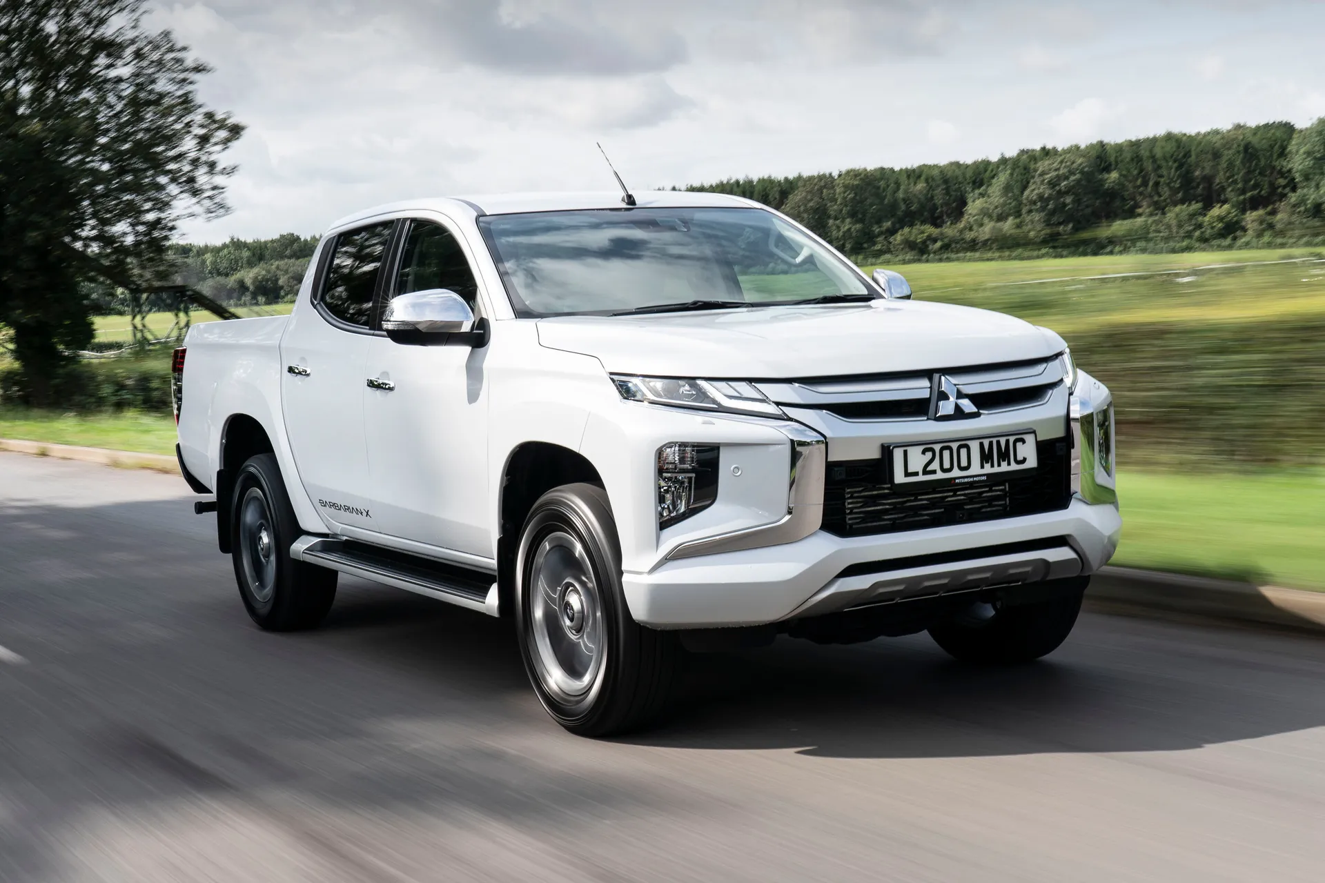 Mitsubishi L200 (2019-2021) Review: exterior front three quarter photo of the Mitsubishi L200 on the road