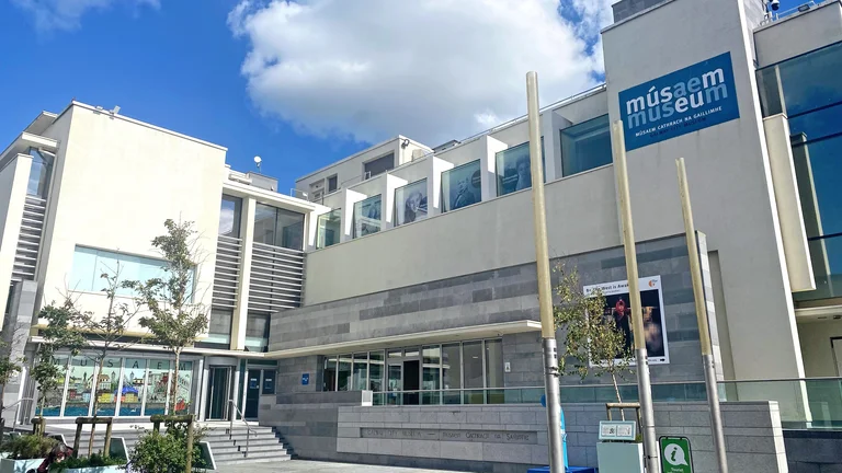 A museum building with a sign on it
