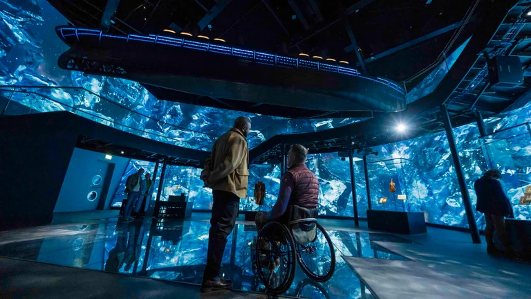 A man in a wheelchair looking at a man in a wheelchair