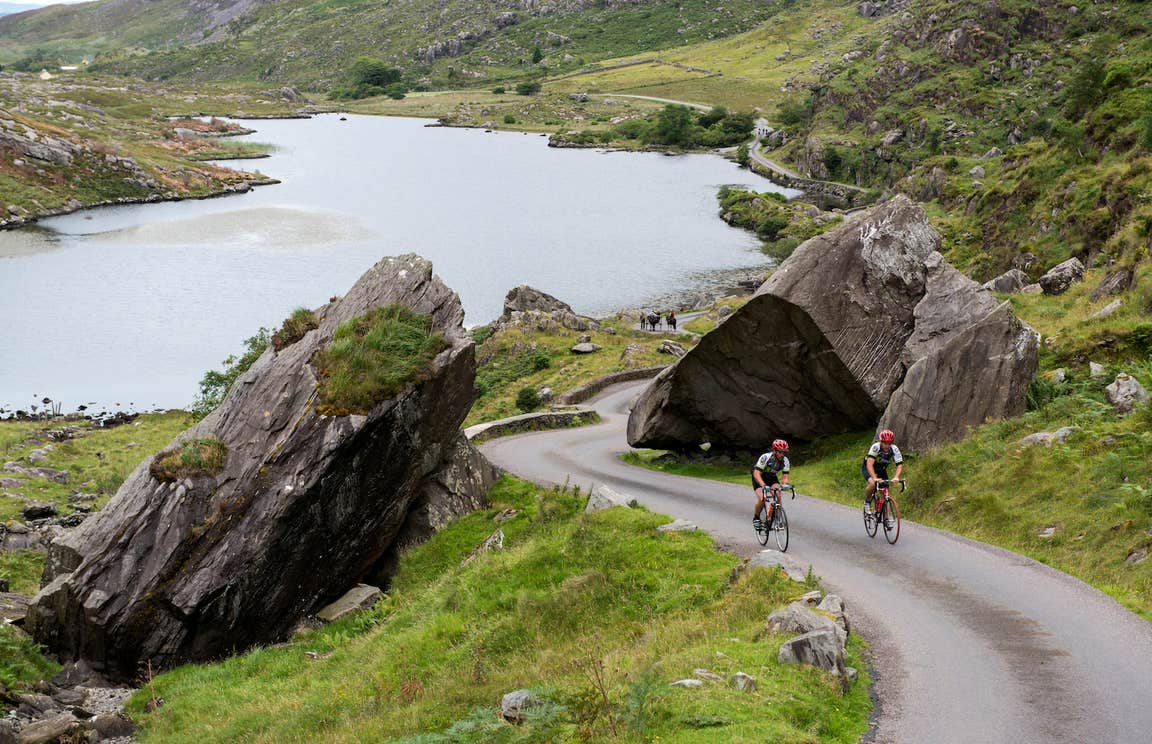 Two cyclists cycling the Ring of Kerry in County Kerry.