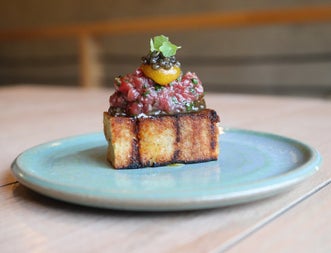 A caviar potato and sourdough chutney dish served at Bastible