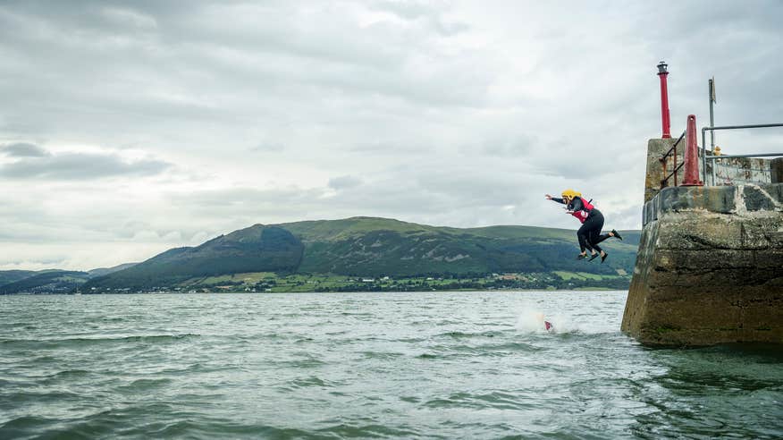 People jumping into the sea from Carlingford Pier in County Louth