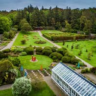 An aerial view across Vandeleur gardens with a glasshouse in the foreground