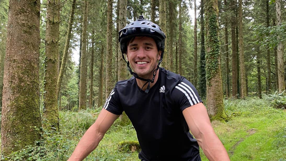 Greg O'Shea surrounded by trees while mountain biking in Offaly